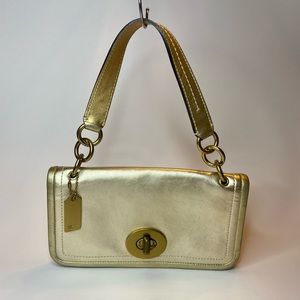 Pre-loved vintage gold leather Coach with handle.